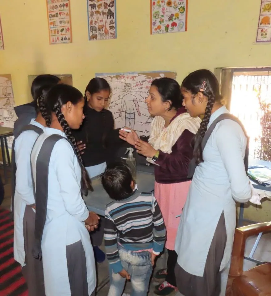 Facilitator explaining an activity to a group of students